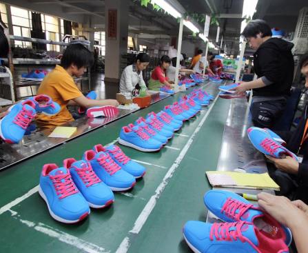 Where are Nike trainers manufactured: A close-up of a Nike trainer being assembled in a factory