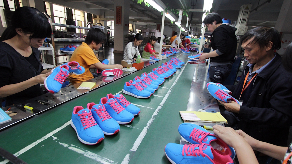 Where are Nike trainers manufactured: A close-up of a Nike trainer being assembled in a factory